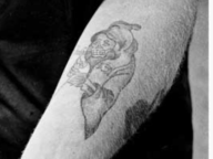 An Arm with a Grim Reaper Tattoo